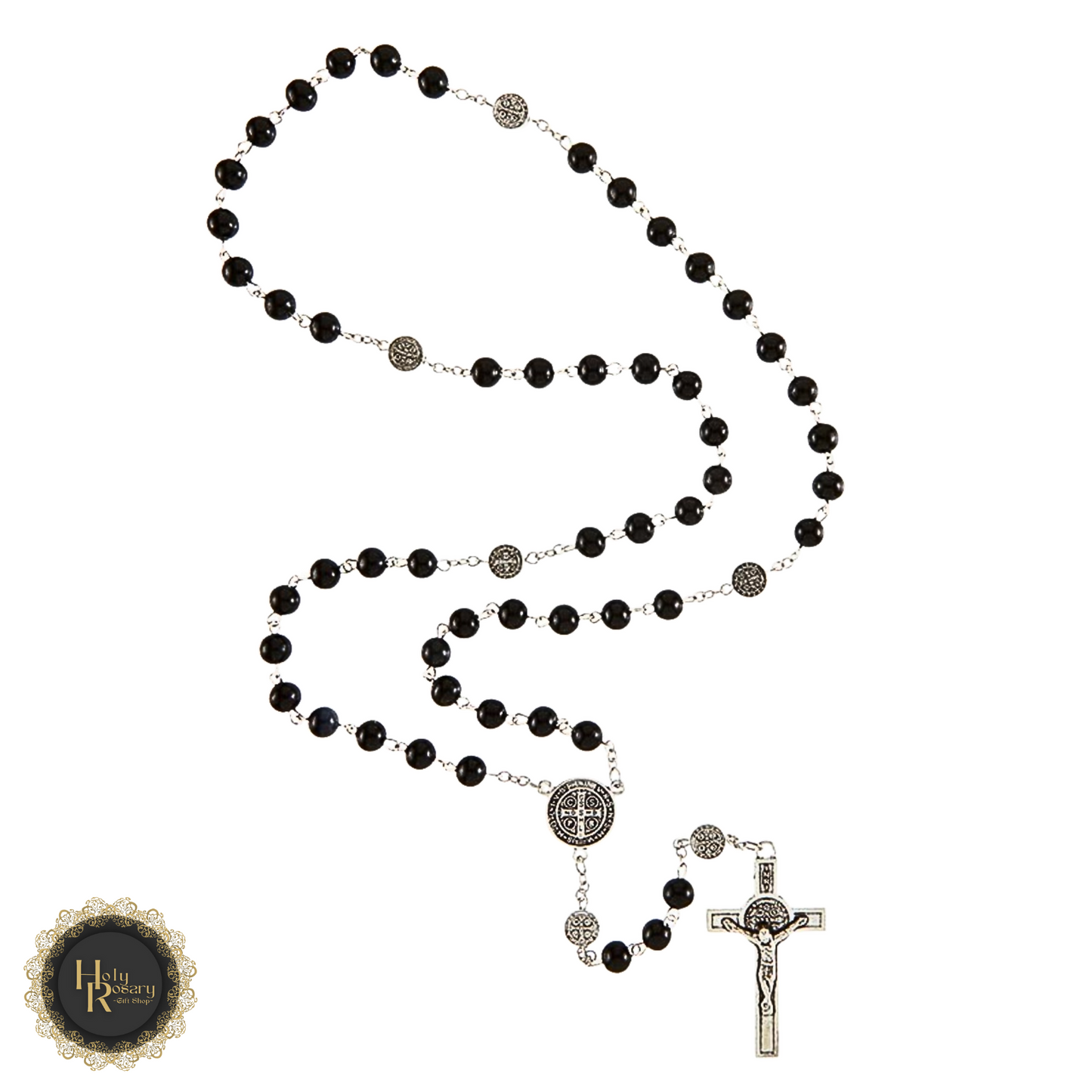 Black rosary beads with St. Benedict medals shown in prayer setting

