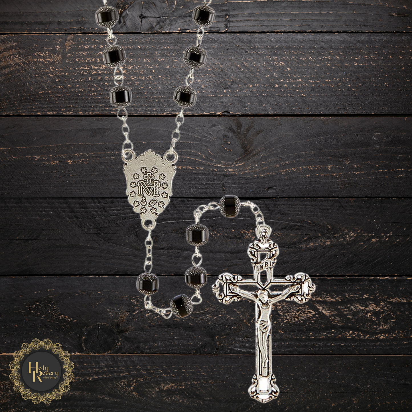 Flat lay of black rosary beads a thoughtful devotional item or meaningful gift