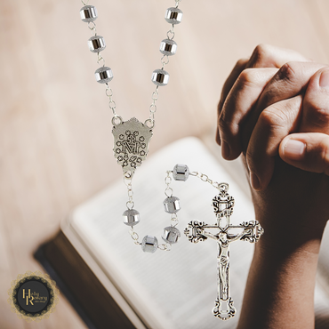 Classic silver rosary necklace with detailed silver cross and beads perfect for prayer and reflection