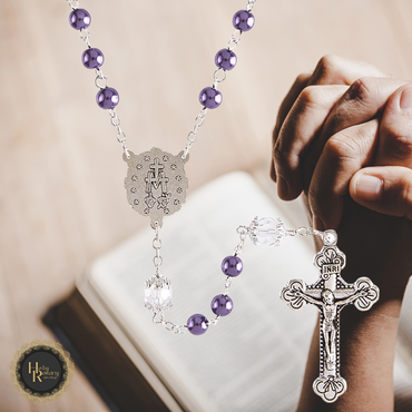 Elegant purple pearl rosary with crystal accents and detailed crucifix