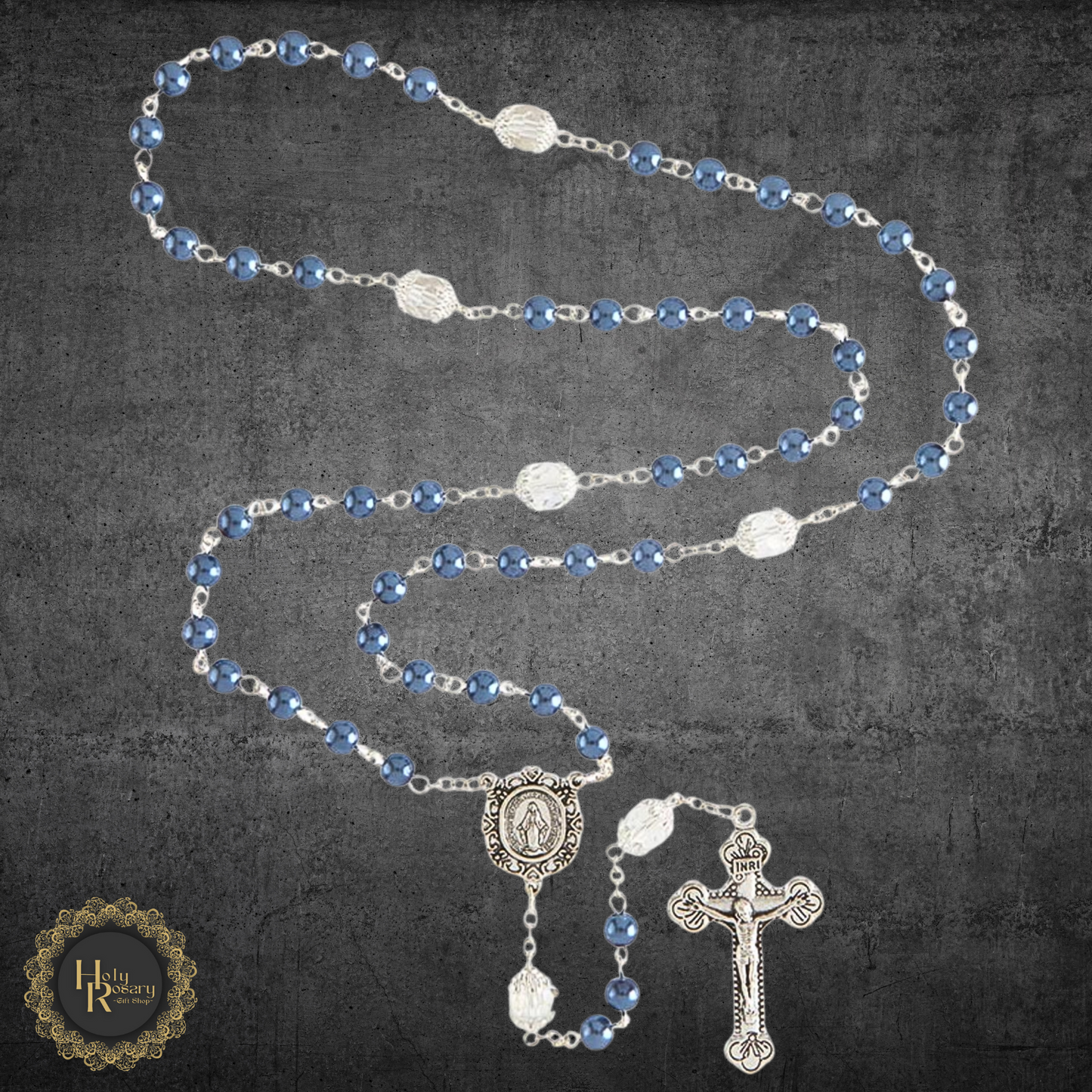 close-up detail of the pearl rosary necklace beads and silver centerpiece