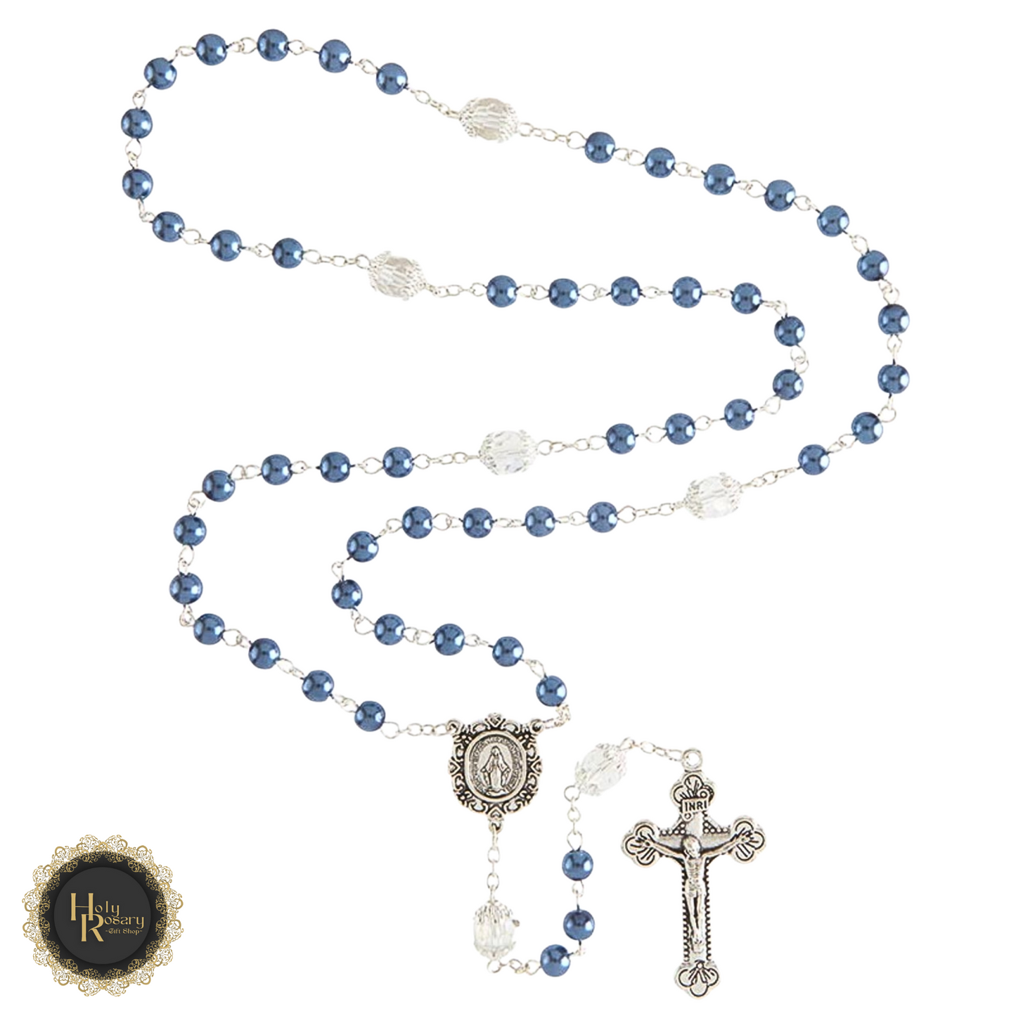 close-up of the silver centerpiece and crucifix on a pearl rosary necklace