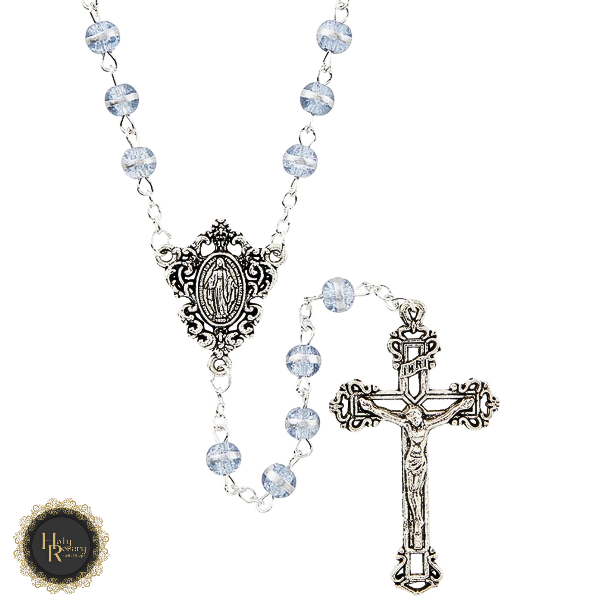 Detailed view of the scroll Miraculous centerpiece on violet rosary beads